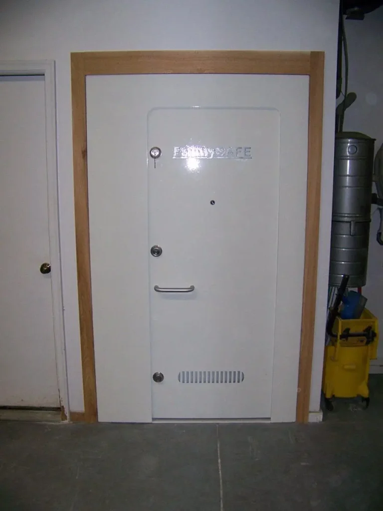 Heavy steel safe door installed in wall
