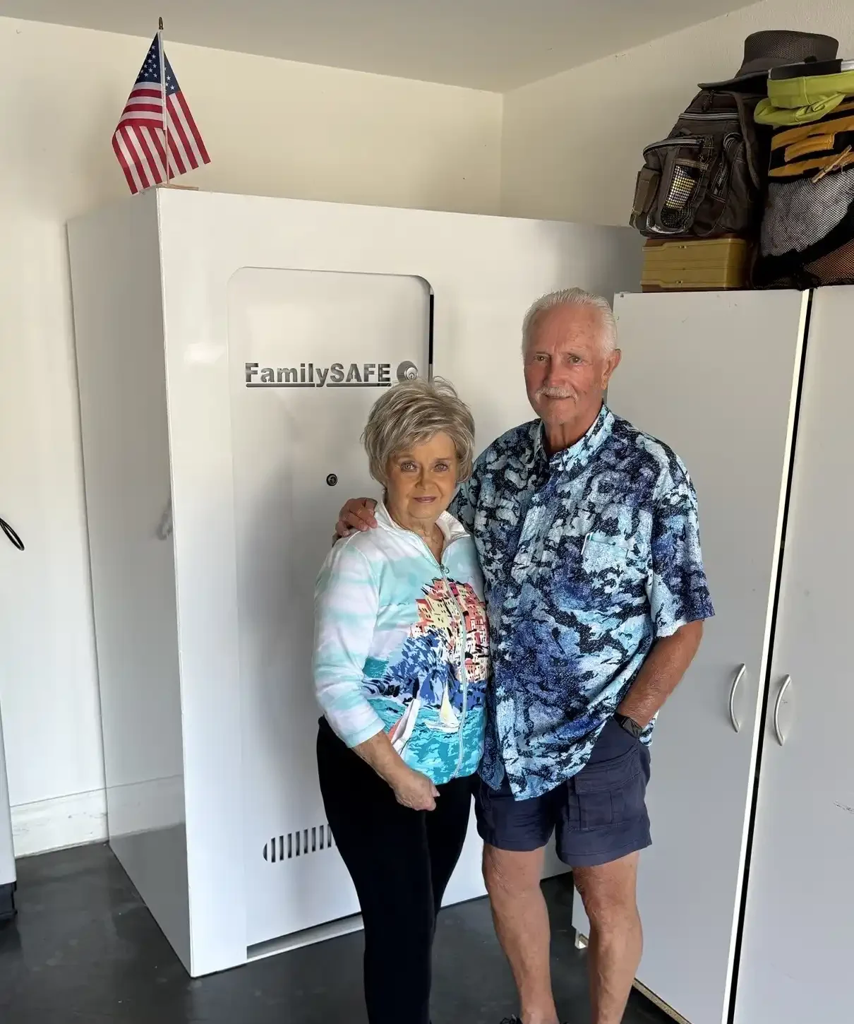 Elderly couple posing by FamilySAFE shelter