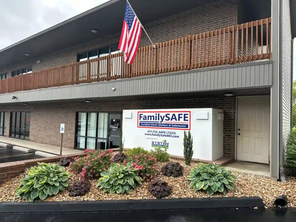 Two-story building with American flag outside.