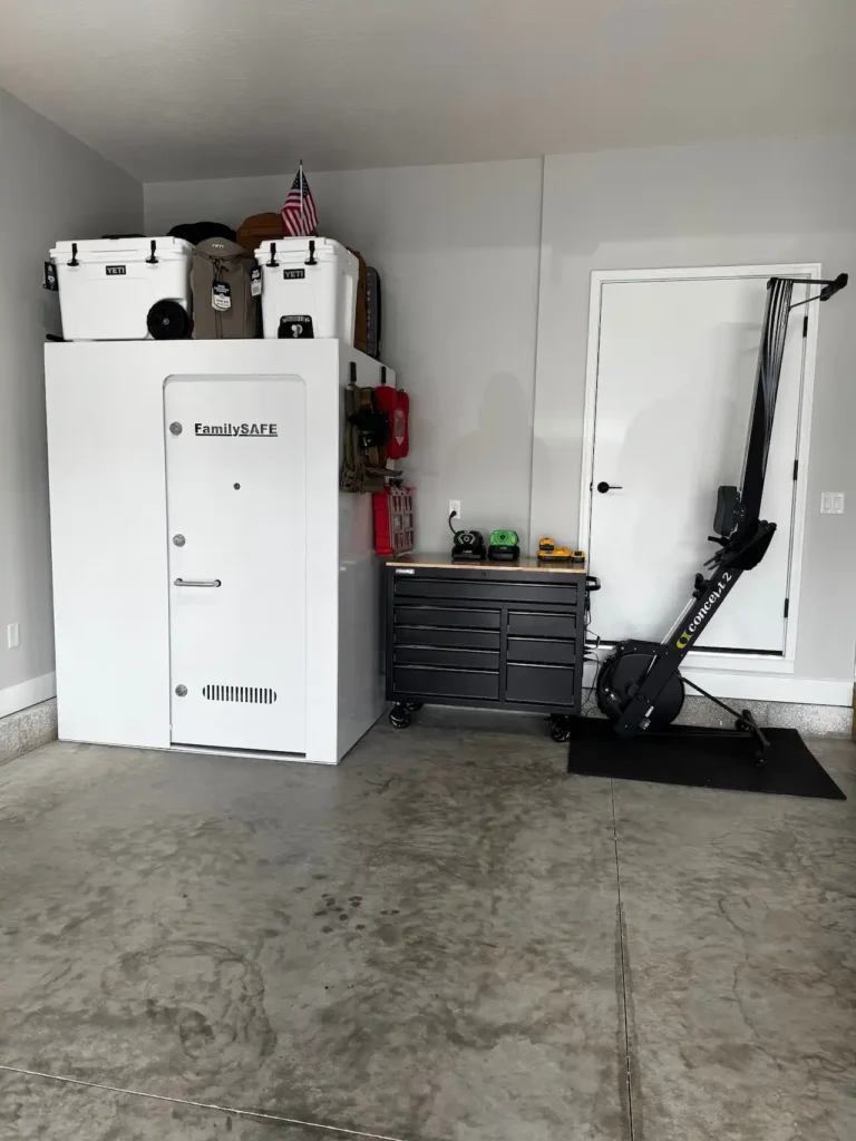 Garage with storm shelter, tool chest, rowing machine