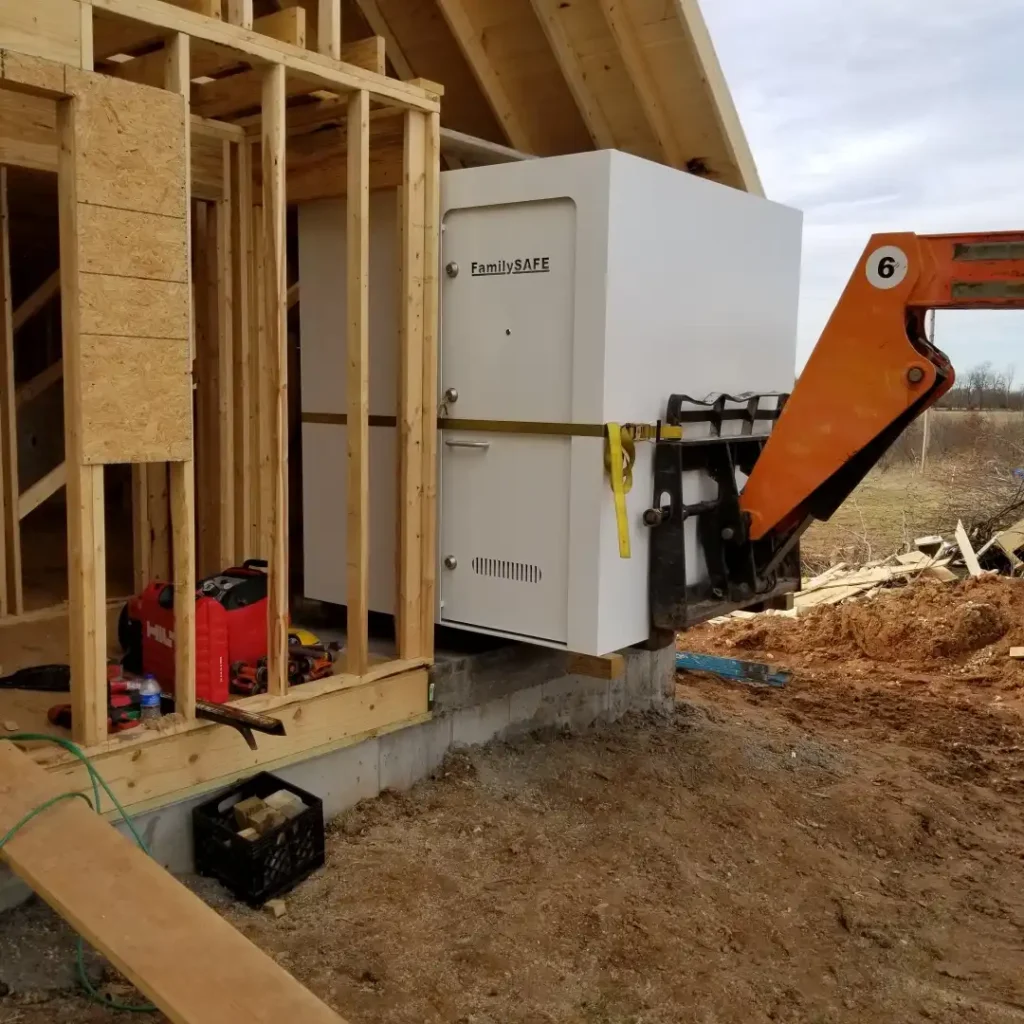 Storm shelter being installed in new home frame
