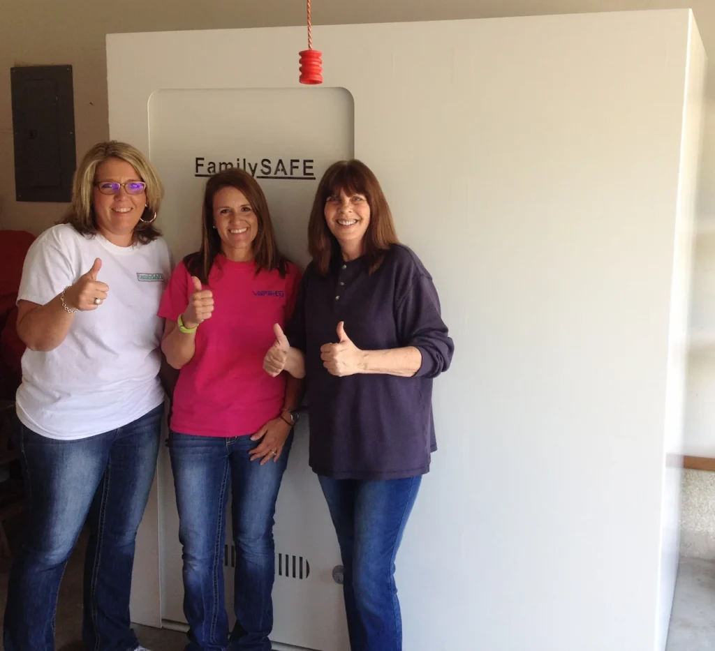Three women giving thumbs up by FamilySAFE safe