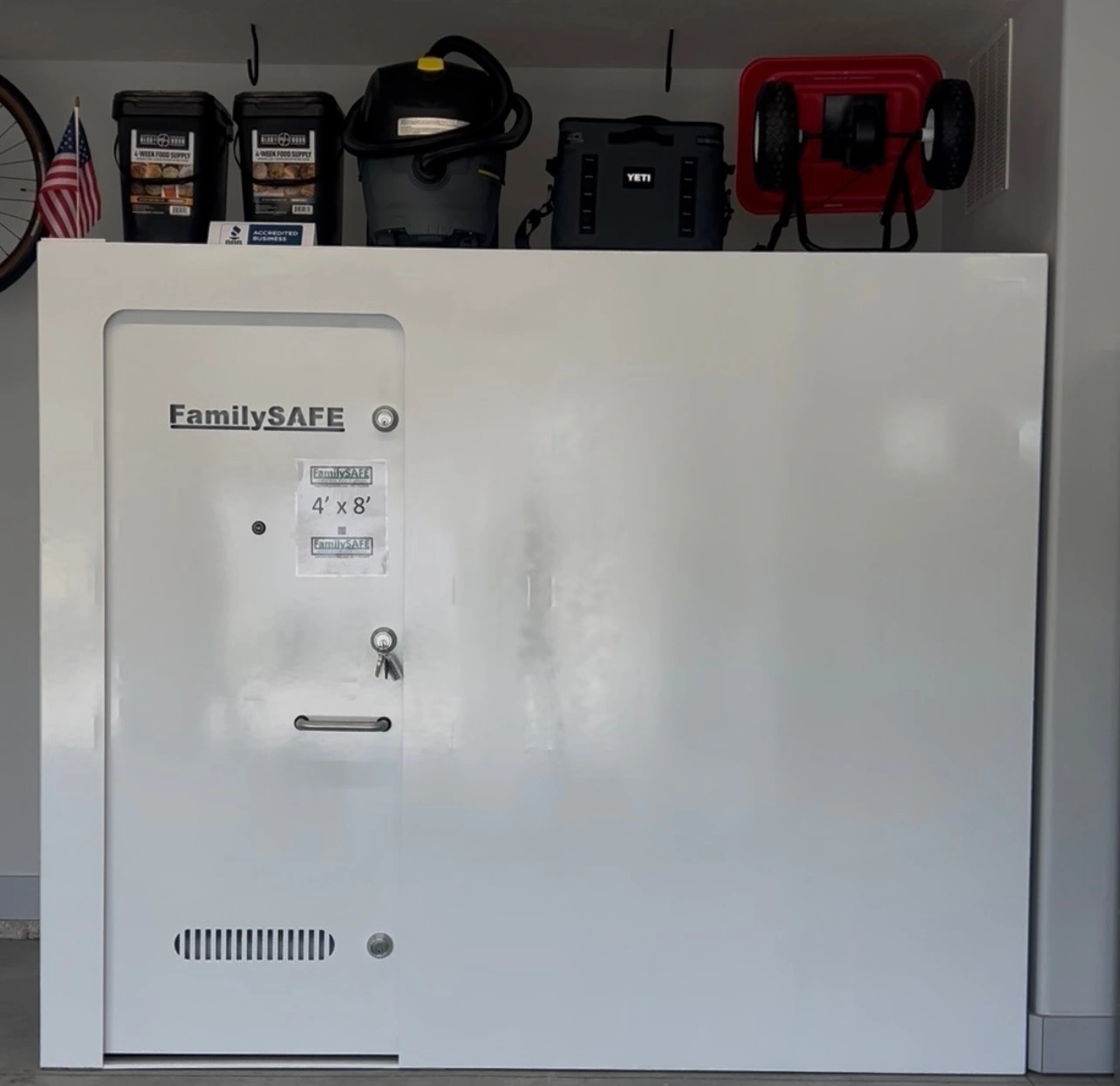 FamilySAFE storm shelter door in garage with supplies