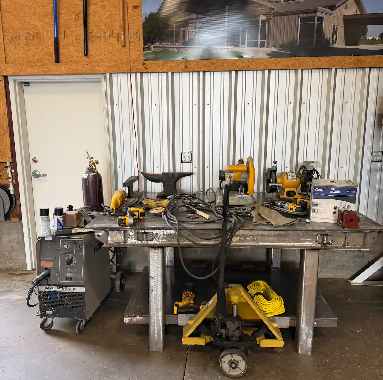 Metal workbench with welding tools and equipment